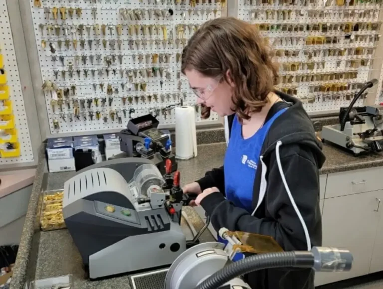 Locksmith cutting keys at Adams Treasure Coast Lock & Safe